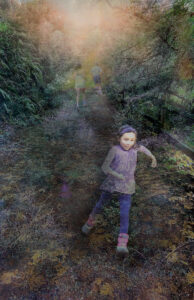 girl runs through forest two people run in opposite direction
