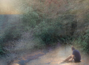 Woman sitting in water contemplating next to forest and landscape